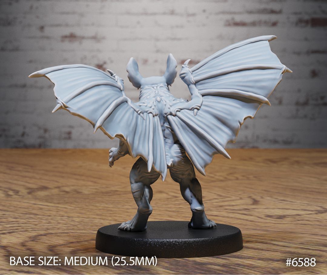 Fantasy figurine with wings on a wooden surface, branded &