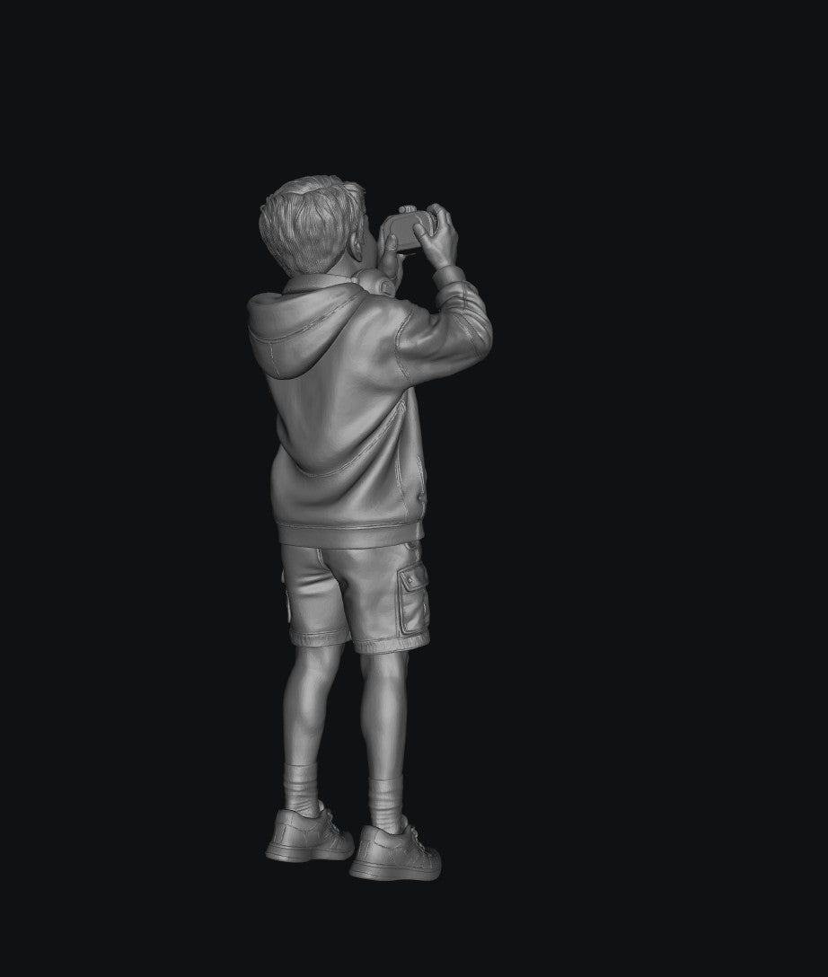 WOSC011 - Young Boy with a Camera